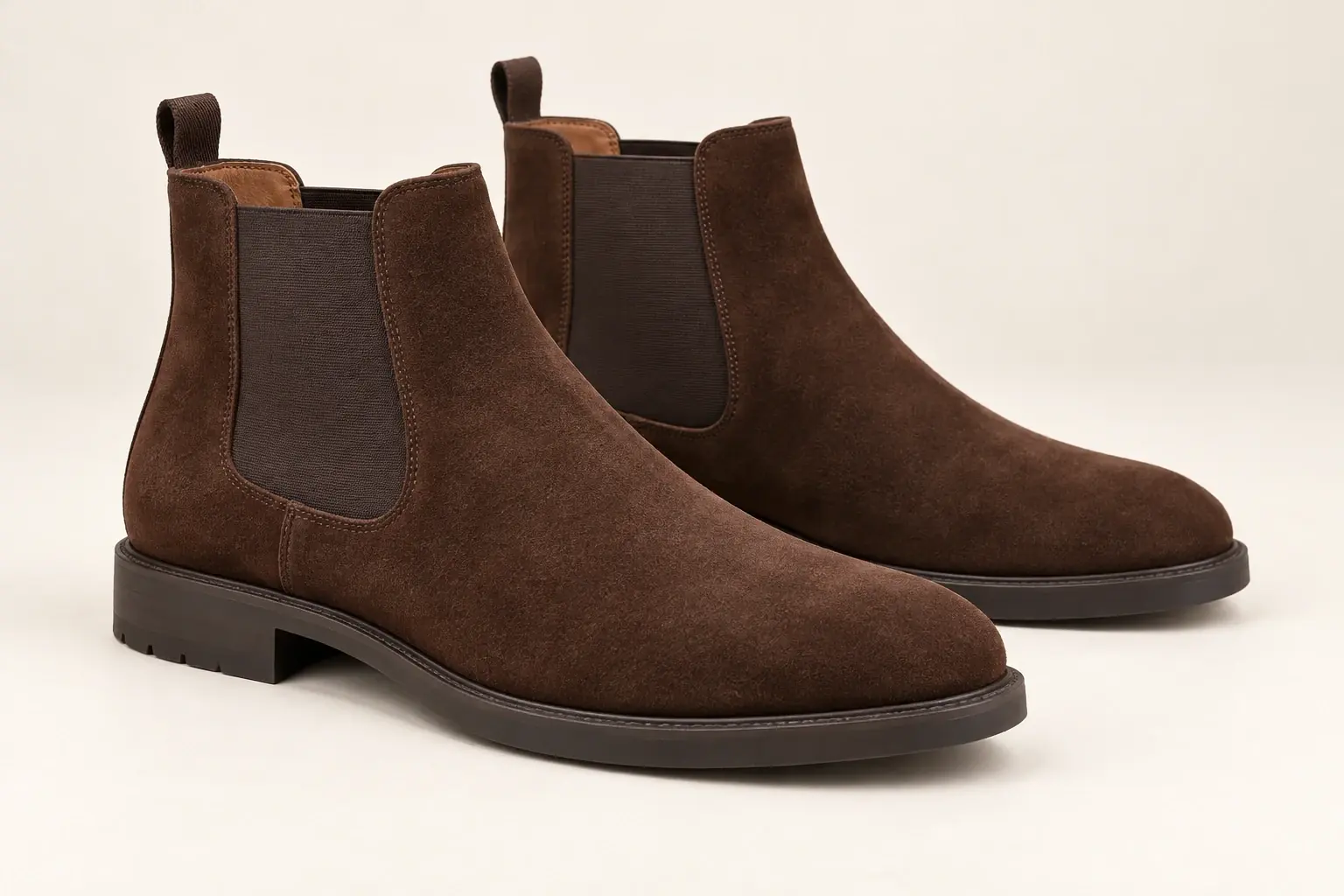 AI illustration of unbranded brown suede Chelsea boots with elastic side panels and no laces.